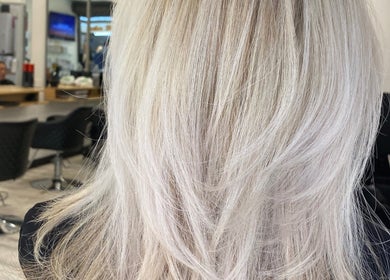 Freshly styled blonde hair at me and you hair salon in Corrimal, New South Wales, AU, showcasing expert hair treatment.