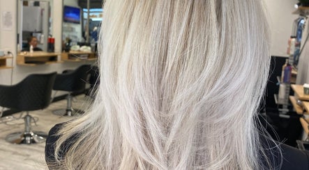 Freshly styled blonde hair at me and you hair salon in Corrimal, New South Wales, AU, showcasing expert hair treatment.