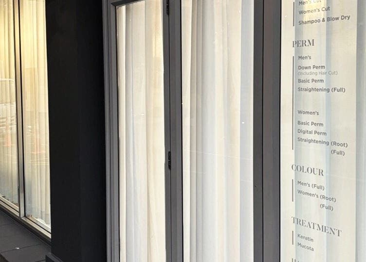 Chloe Hair's stylish exterior with service menu in Auckland, Auckland, NZ.