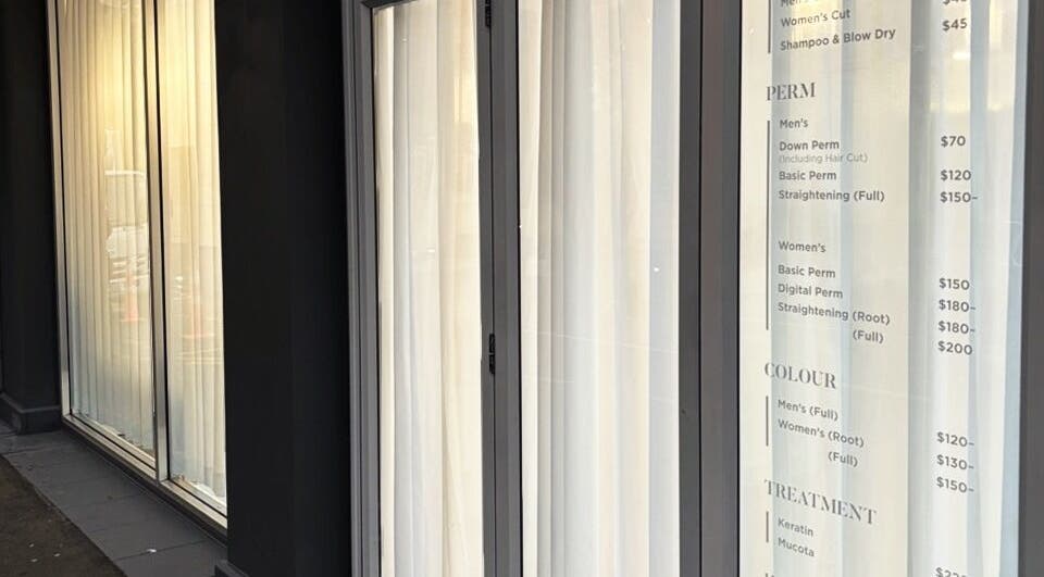 Chloe Hair's stylish exterior with service menu in Auckland, Auckland, NZ.