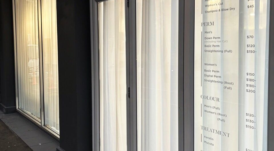 Chloe Hair's stylish exterior with service menu in Auckland, Auckland, NZ.
