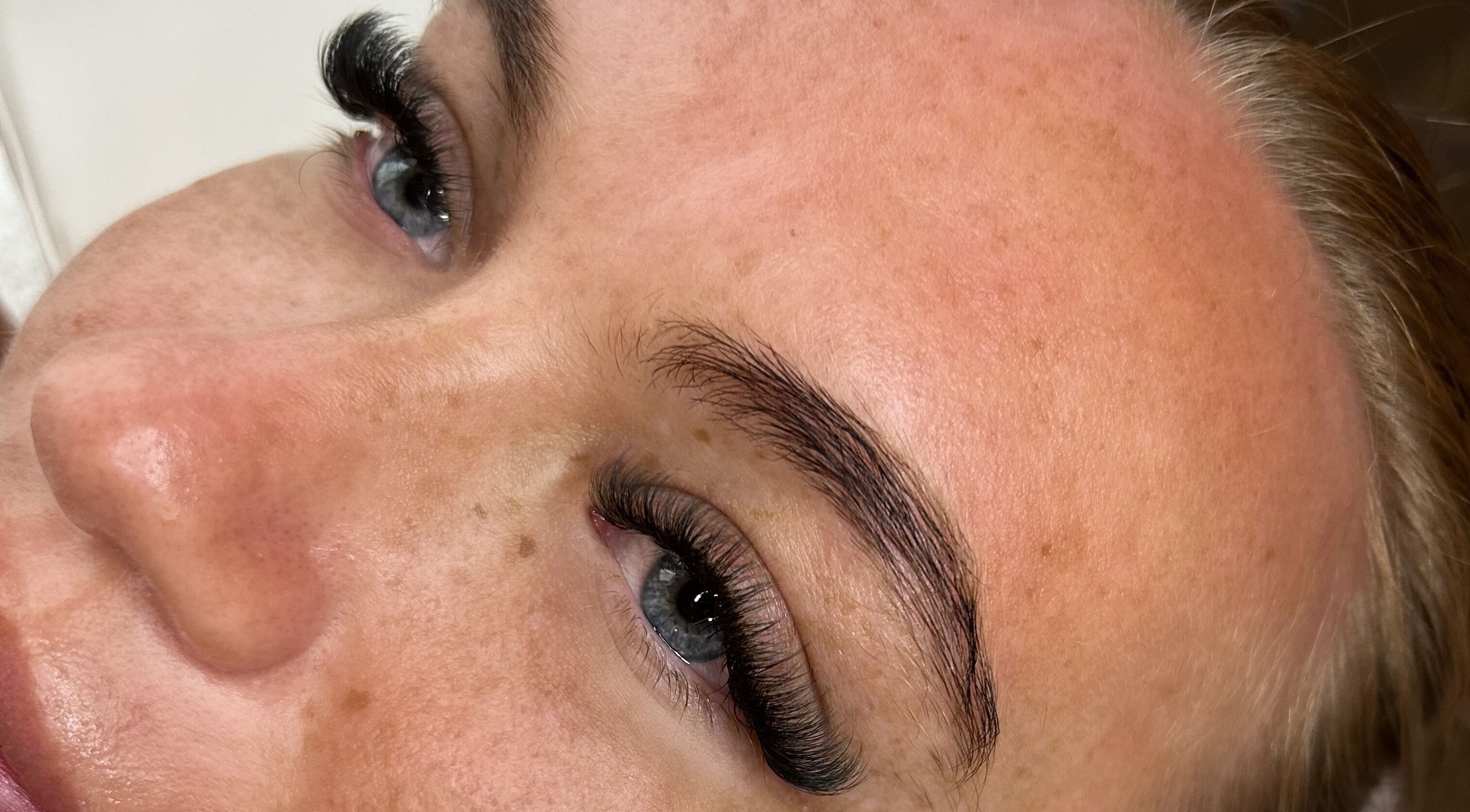 Close-up of enhanced eyelashes at House of Belle, Rushden, England, GB showcasing precise lash extension work.
