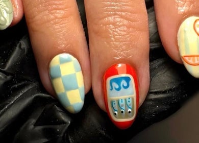 Creative nail art designs at Llookinglassbeauty in Horton, England, GB, showcasing vibrant colors and unique patterns.
