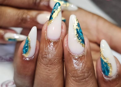 Exquisite nail art with blue and gold design at Posh Pamper Specialists, Cape Town, Western Cape, ZA.