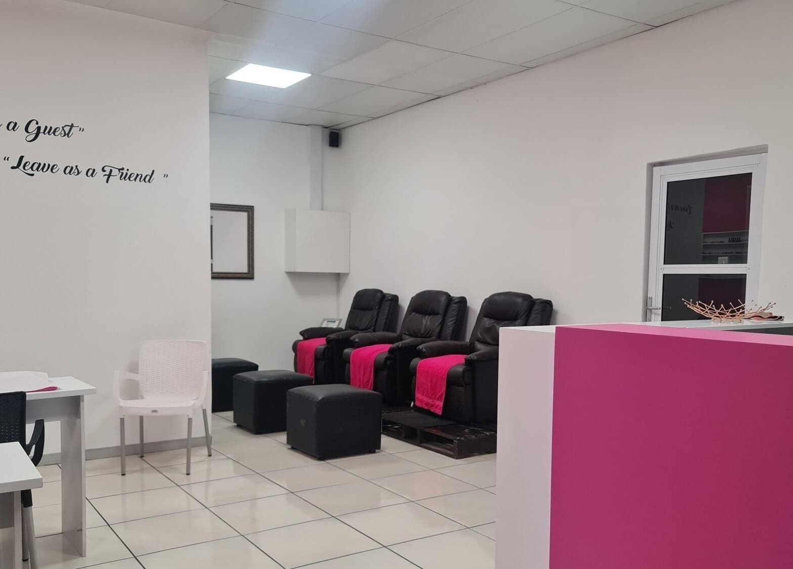 Relaxing lounge area at Posh Pamper Specialists, Cape Town, Western Cape, ZA, with plush seating and a friendly vibe.