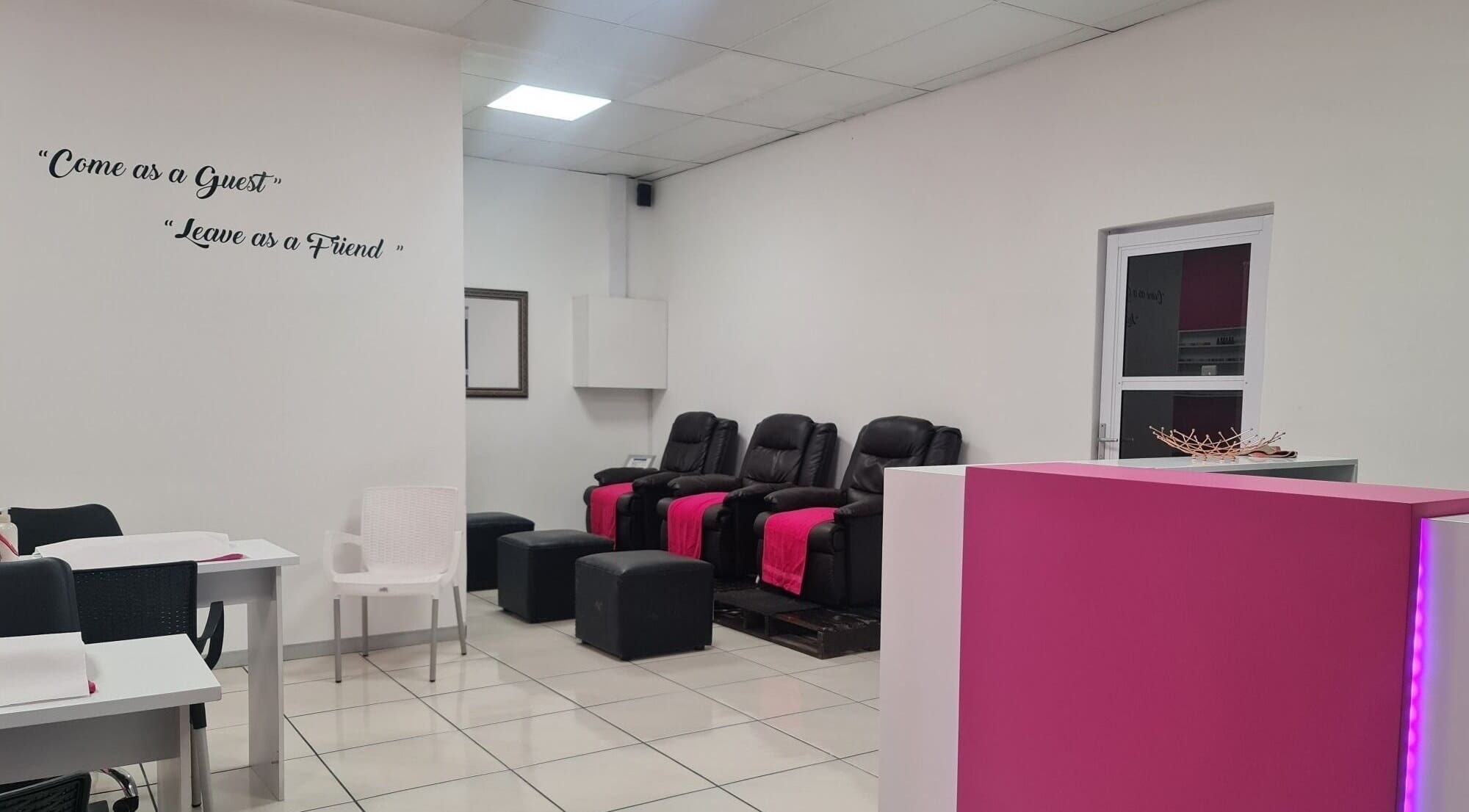 Relaxing lounge area at Posh Pamper Specialists, Cape Town, Western Cape, ZA, with plush seating and a friendly vibe.