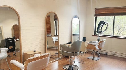 Cozy interior of Hi Six Hair Studio in Parramatta, New South Wales, AU, featuring stylish chairs and mirrors.