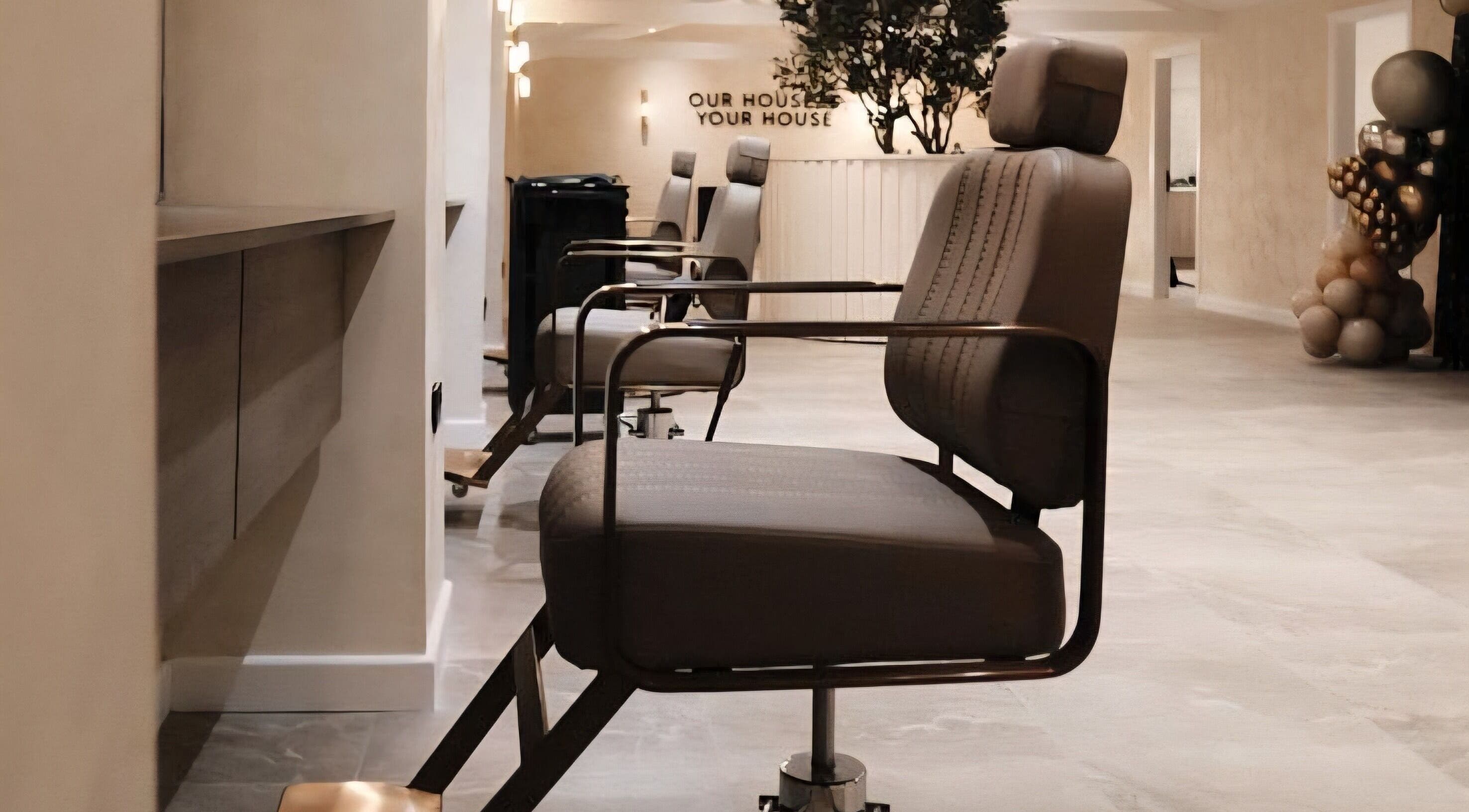 Modern salon chairs at Hair by Sian Smith, Telford, England, GB reflect stylish and comfortable setting.