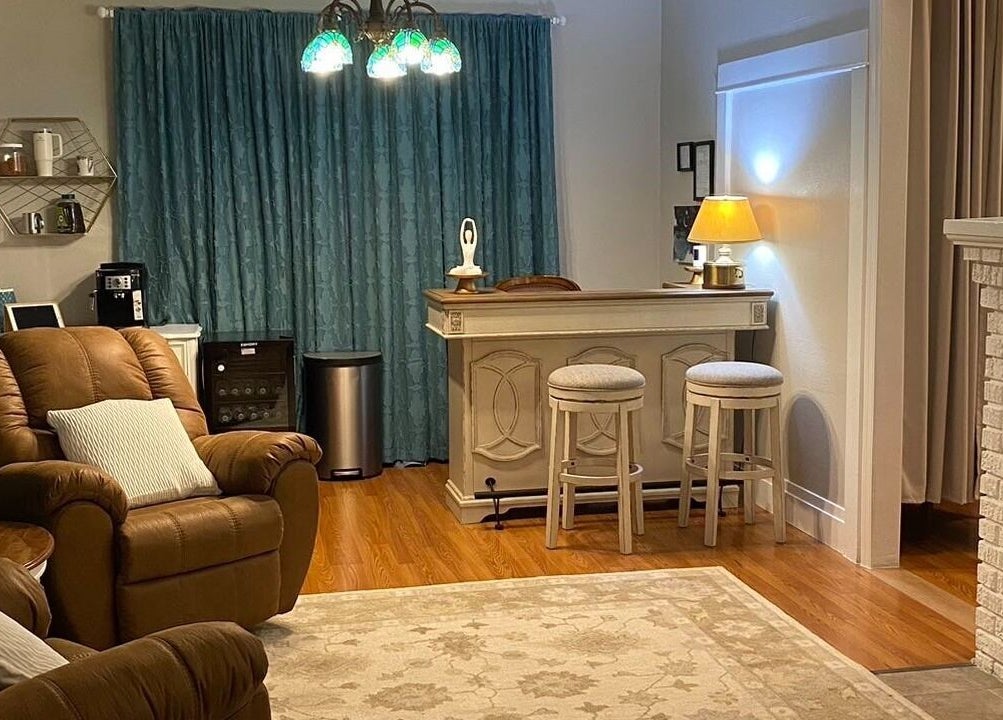 Relaxing lounge area at Cindy's Amazing Massage and Spa, Sarasota, Florida, US, with comfy chairs and elegant decor.