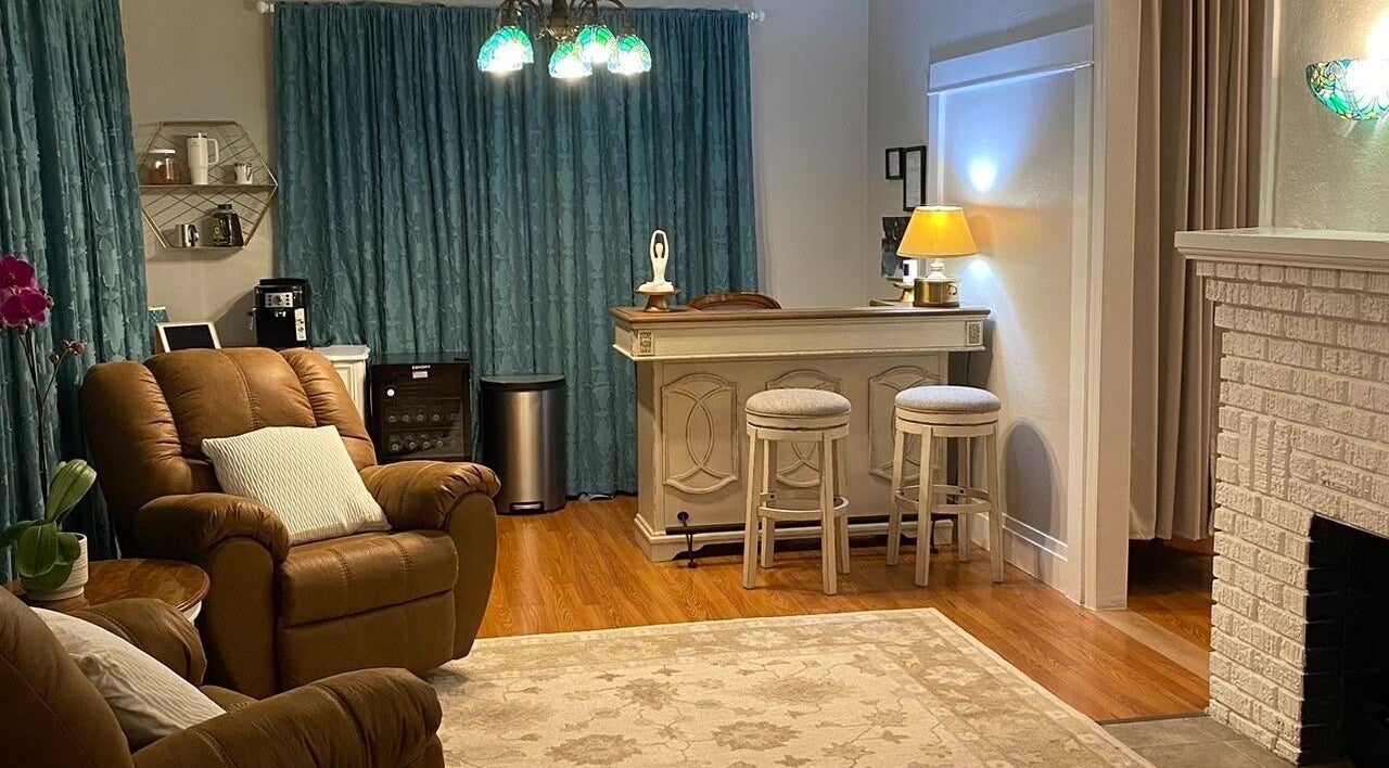 Relaxing lounge area at Cindy's Amazing Massage and Spa, Sarasota, Florida, US, with comfy chairs and elegant decor.