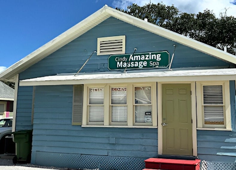 Cindy's Amazing Massage and Spa in Sarasota, Florida, US, showcases a charming blue exterior with a welcoming ambiance.