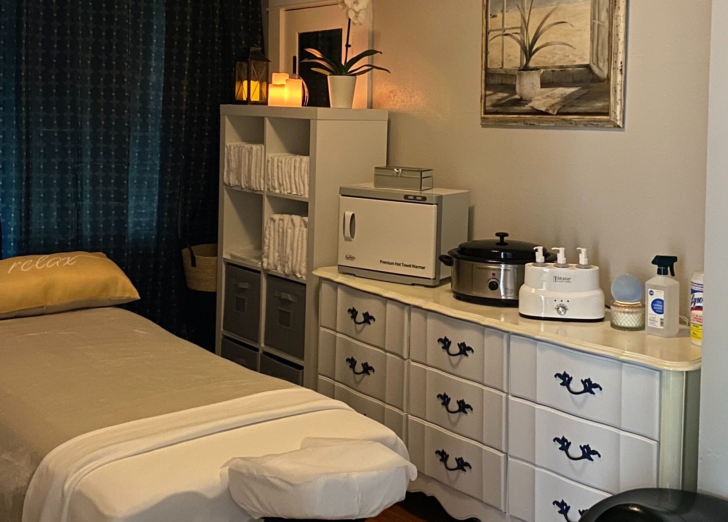 Cozy massage room at Cindy's Amazing Massage and Spa, Sarasota, Florida, US. Features relaxing decor and equipment.