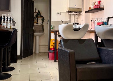 Modern salon interior at Ivor Hairdressing in Stoke-on-Trent, England, GB featuring sleek washing stations.