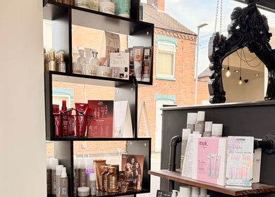 Haircare product display at Ivor Hairdressing, Stoke-on-Trent, England. Elegant shelf with premium items.