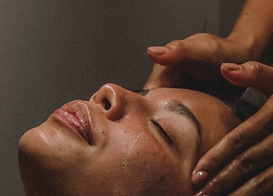 Relaxing facial massage at Alam Wellness Bali in Denpasar, Bali, ID promotes tranquility and rejuvenation.