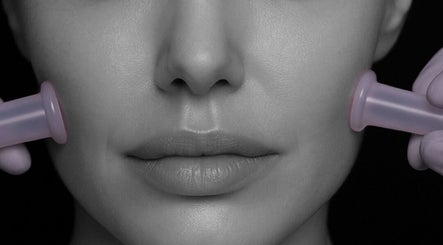 Facial cupping therapy session at The Massage Manor Crystal Med Spa in Windsor, Ontario, CA, enhancing skin radiance.