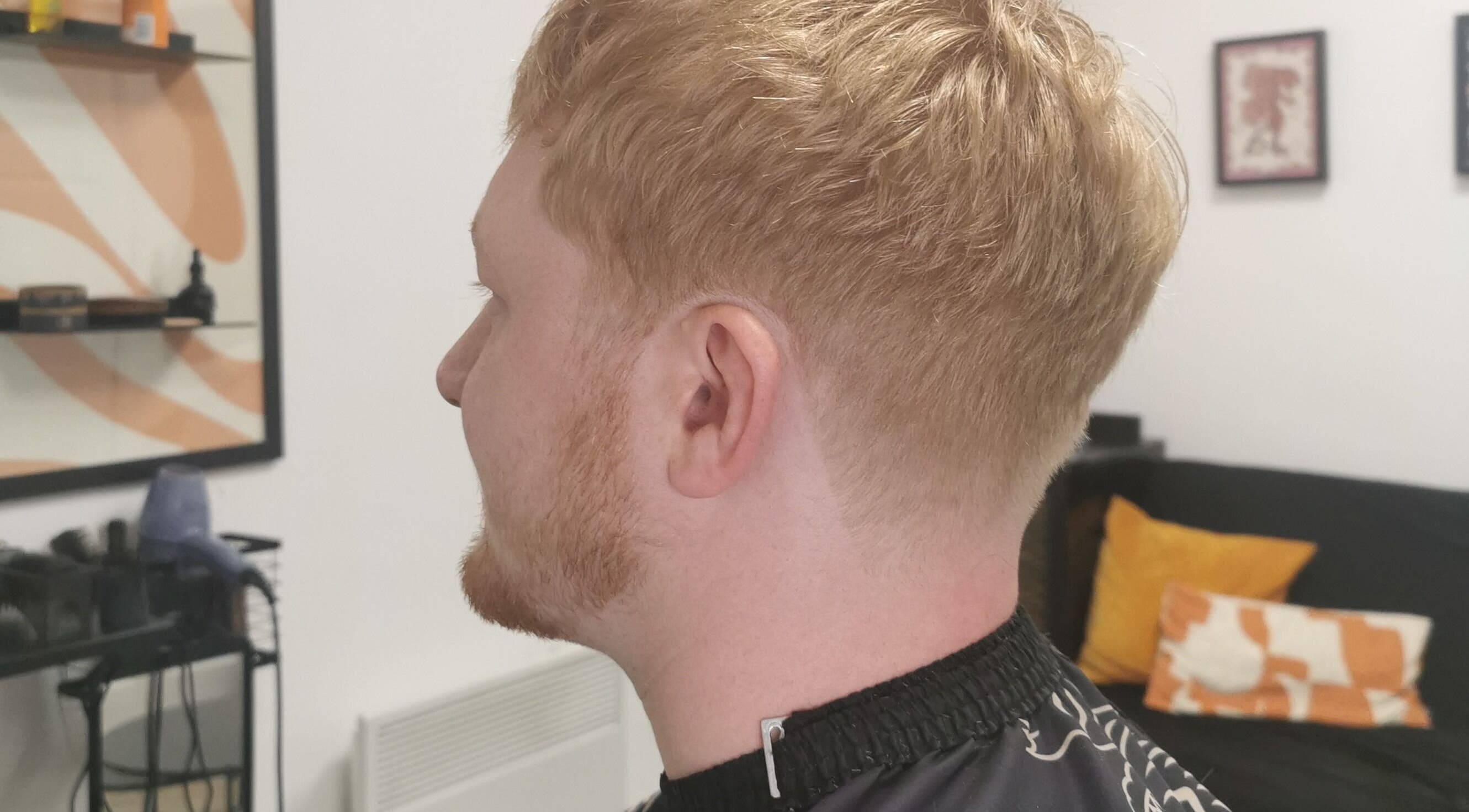 Side view of stylish haircut at Barber Girl Wolf, Farnworth, England, GB showcasing expert grooming.