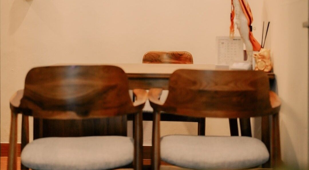 Cozy consultation room at Acupuncture Bali, Nusa Dua, featuring elegant wooden chairs. Located in Bali, Bali, ID.