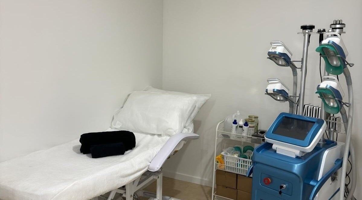 Treatment room at Tone N Sculpt, Liverpool, New South Wales, AU with a massage bed and advanced wellness equipment.
