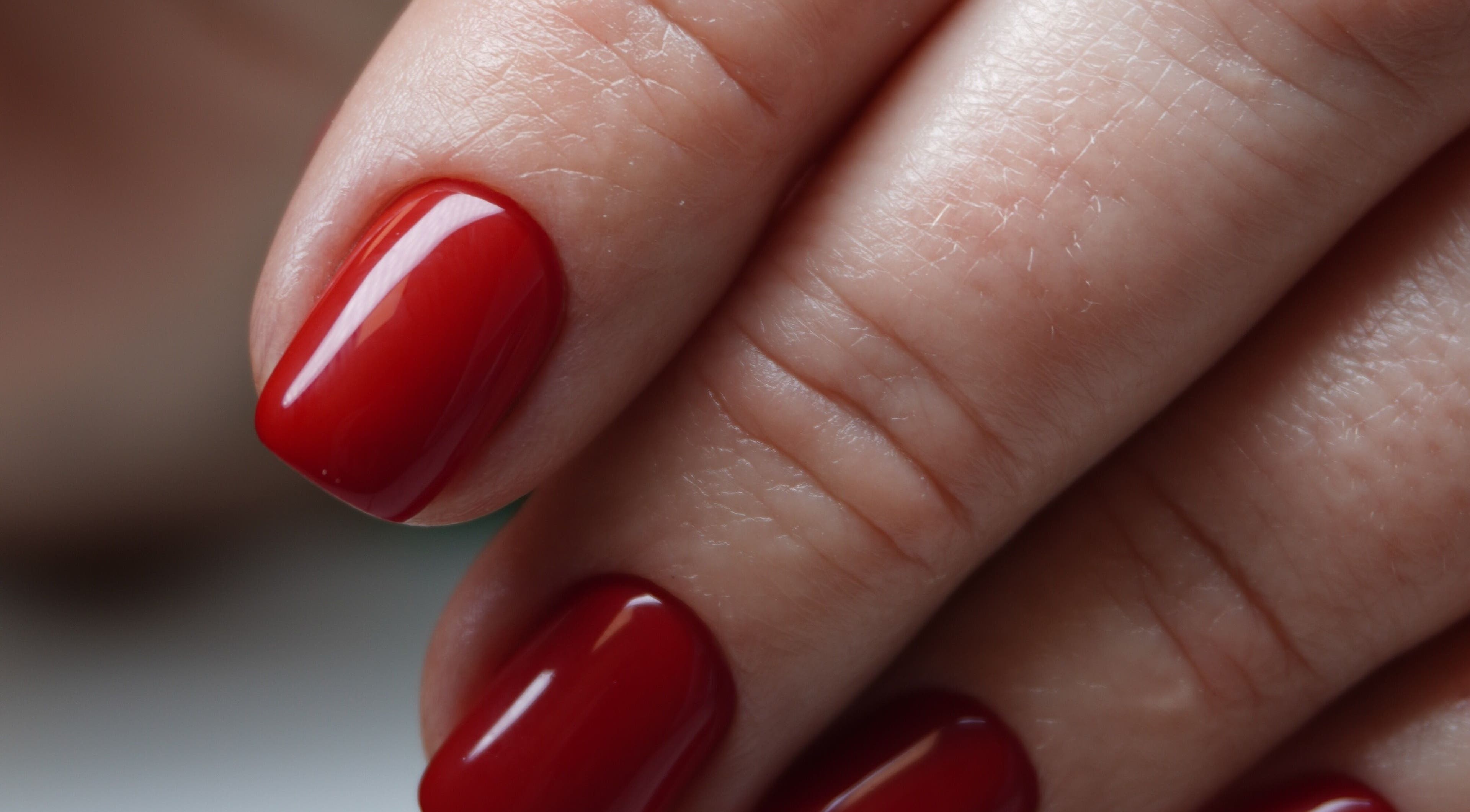 Elegant red manicure at Touch, Royal Tunbridge Wells, England, GB showcasing flawless nail art.
