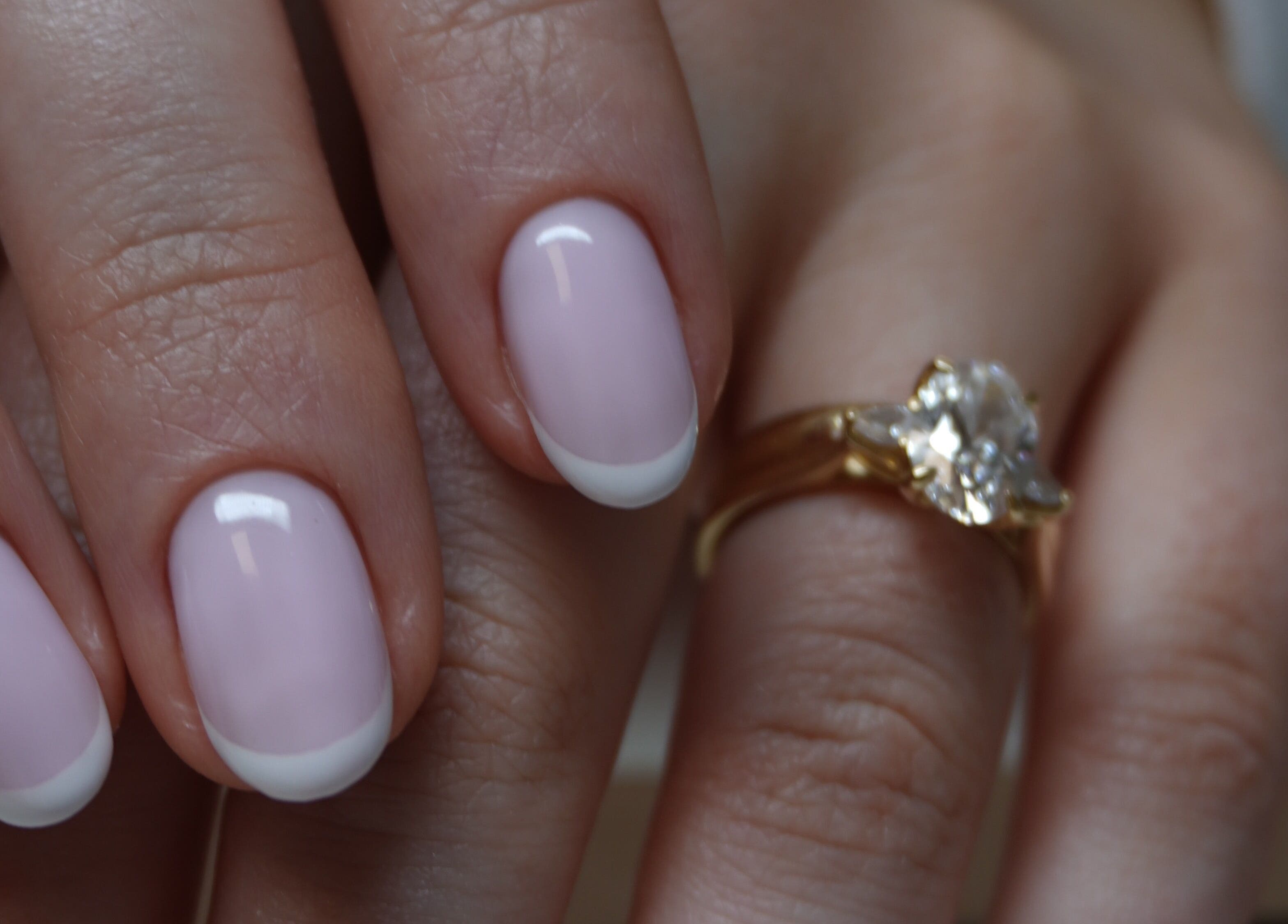 French manicure at Touch in Royal Tunbridge Wells, England, GB, featuring a gold ring.