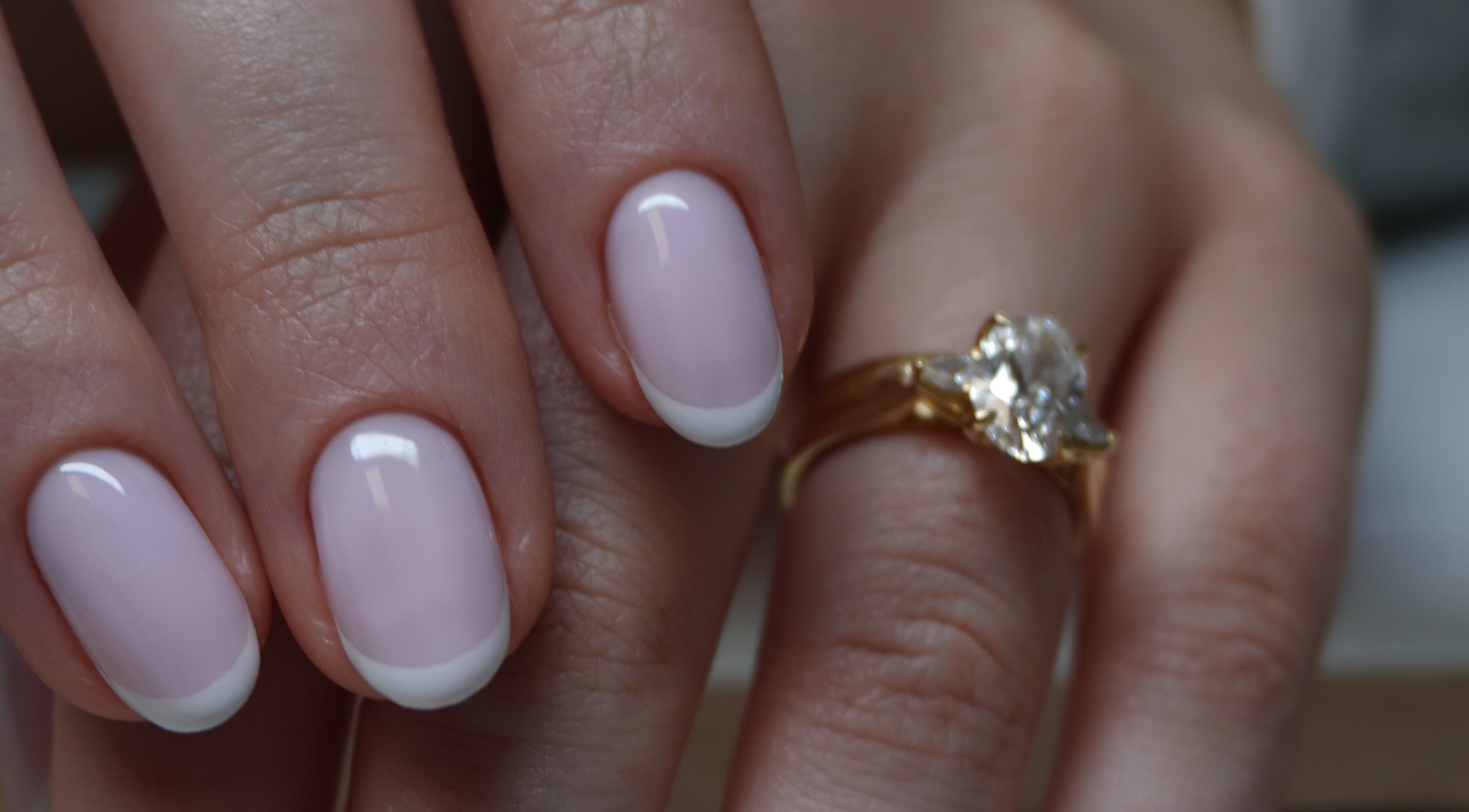 French manicure at Touch in Royal Tunbridge Wells, England, GB, featuring a gold ring.