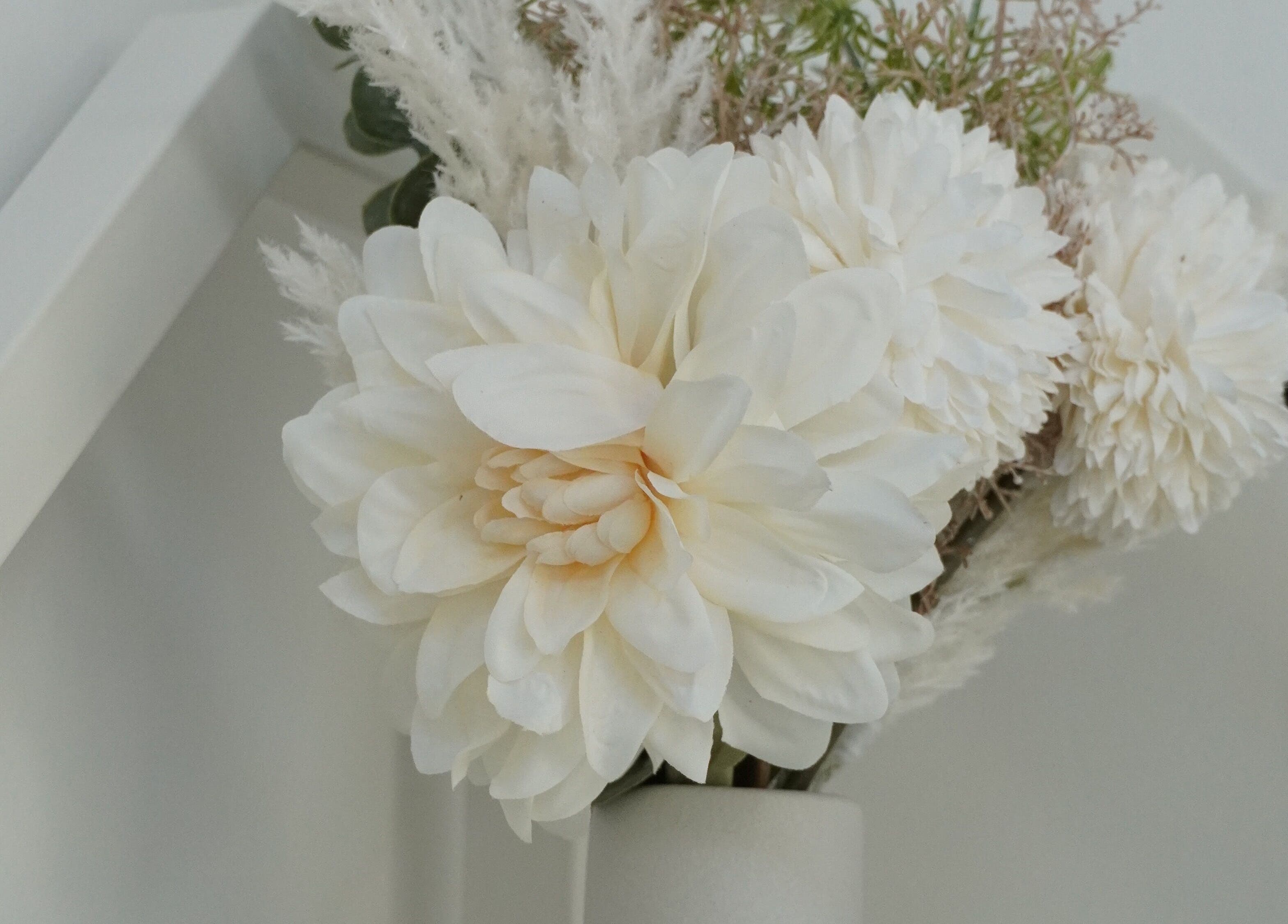 Elegant white flowers in a vase at Touch, Royal Tunbridge Wells, England, GB enhancing serene aesthetics.