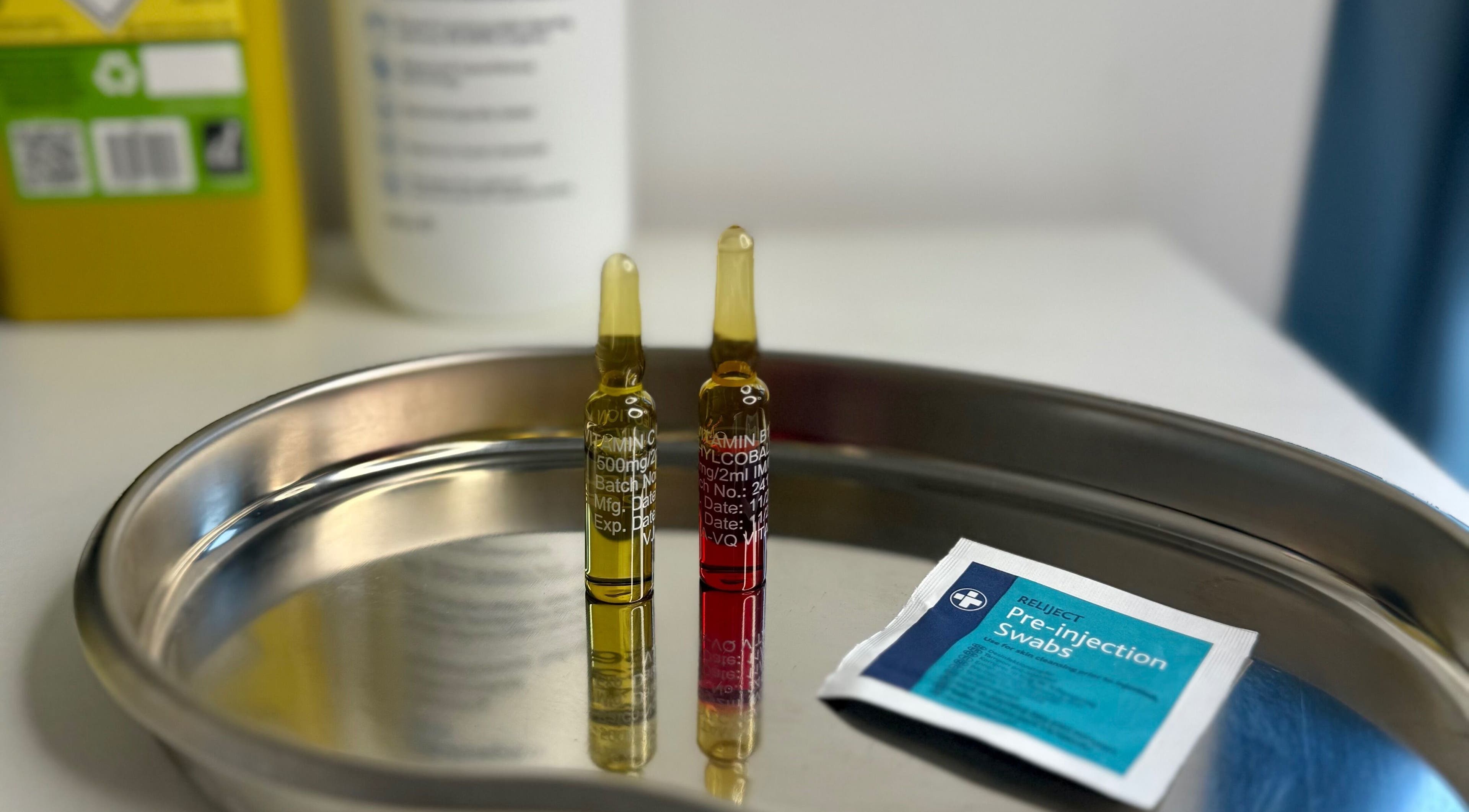 Vitamin ampoules on tray at Yasmin Kitchen Aesthetics in Eastleigh, England, GB.