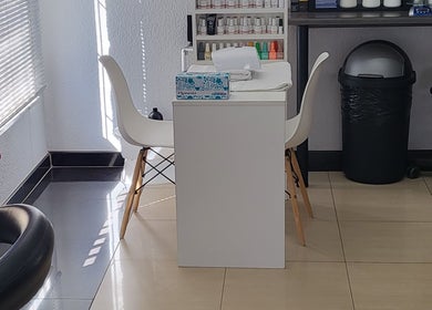 Manicure station at Sparkle Nail Studio, Roodepoort, Gauteng, ZA, showcasing a modern, sunny setting.