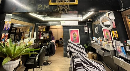 Modern interior of Bmore Barbers Bkk, Krung Thep Maha Nakhon, showcasing sleek barber chairs and stylish decor.