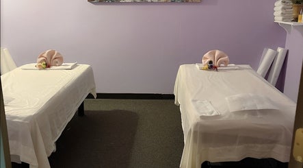 Tranquil massage room at Health Care Massage in Bozeman, Montana, US with two prepared tables.