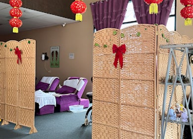 Relaxing massage area at Health Care Massage in Bozeman, Montana, US, with decorated dividers and plush chairs.