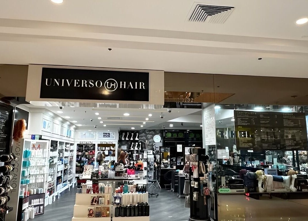 Front view of Universohair salon in Melbourne, AU, showcasing stylish interior and beauty products.