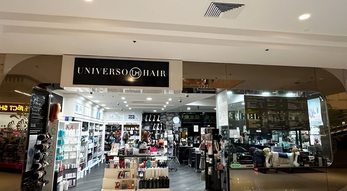 Front view of Universohair salon in Melbourne, AU, showcasing stylish interior and beauty products.