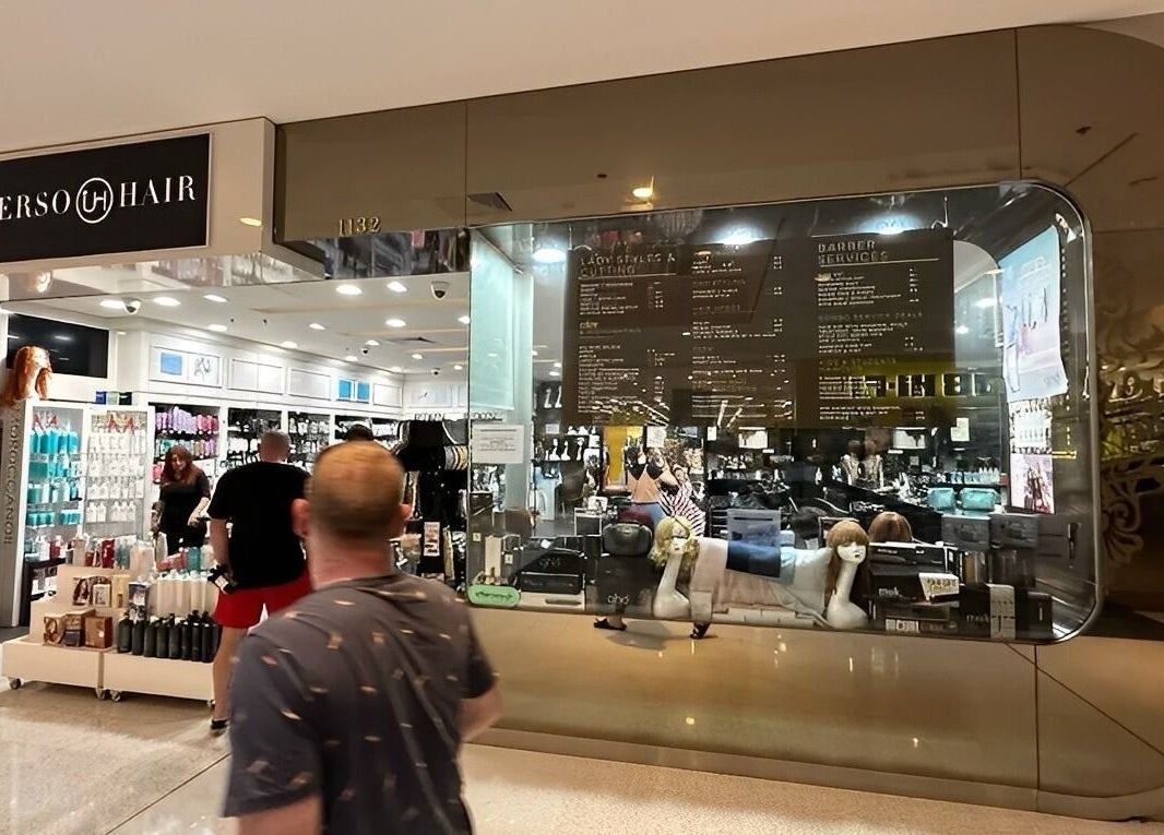 Exterior of Universohair in Melbourne, AU showcasing stylish salon interior and products.