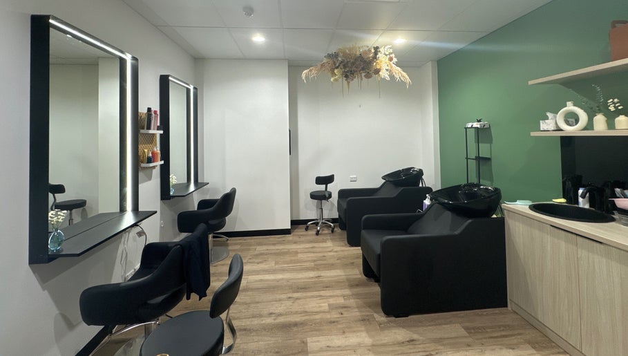 Stylish salon at Daisy Wu - Studio Dejavu in Melbourne, Victoria, AU, with modern styling chairs and sleek decor.