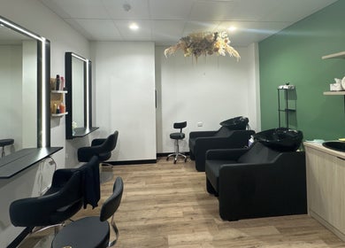 Stylish salon at Daisy Wu - Studio Dejavu in Melbourne, Victoria, AU, with modern styling chairs and sleek decor.