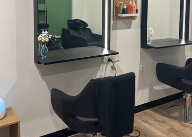 Sophisticated salon setup at Daisy Wu - Studio Dejavu, Melbourne, Victoria, AU. Modern chairs and soft lighting.