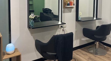 Sophisticated salon setup at Daisy Wu - Studio Dejavu, Melbourne, Victoria, AU. Modern chairs and soft lighting.