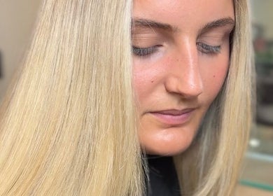 Close-up of sleek blonde hair styled at Daisy Wu - Studio Dejavu, Melbourne, Victoria, AU.