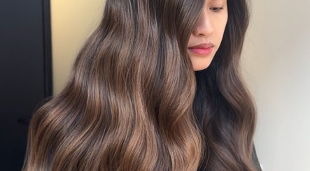 Lush, wavy brown hair styled at Studio DejaWu, Melbourne, Victoria, AU, capturing elegance and shine.