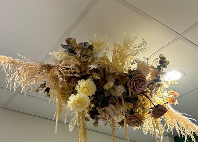 Elegant floral arrangement at Studio Deja Wu, Melbourne, Victoria, AU enhancing the ceiling's ambiance.