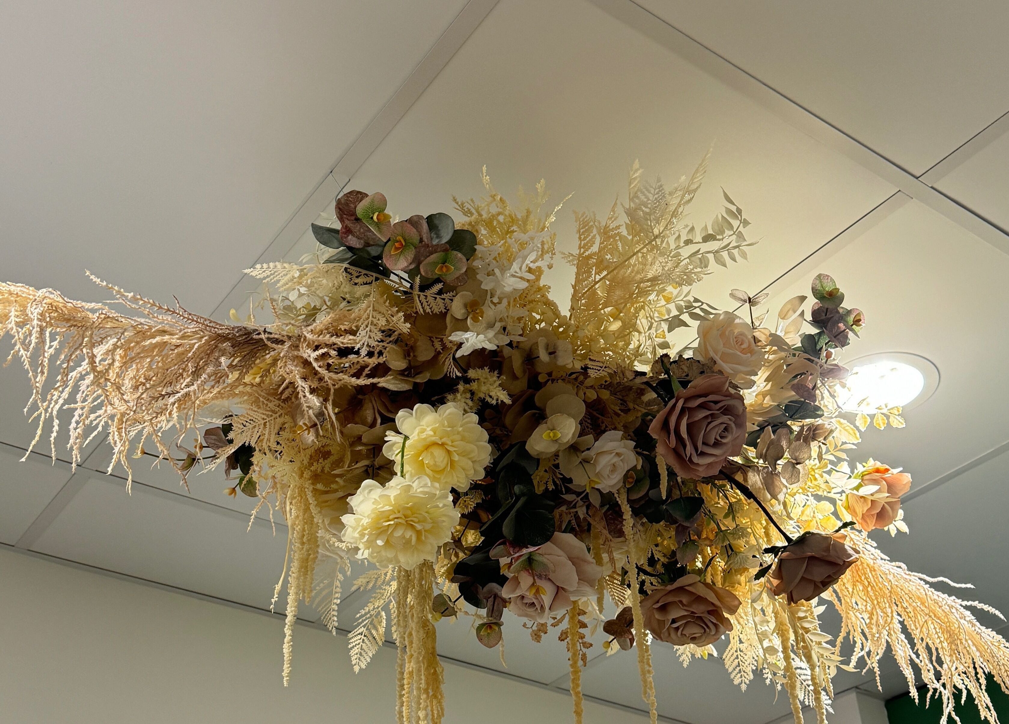 Exquisite floral ceiling arrangement at Studio Deja Wu, Melbourne, Victoria, AU, enhancing wellness ambiance.