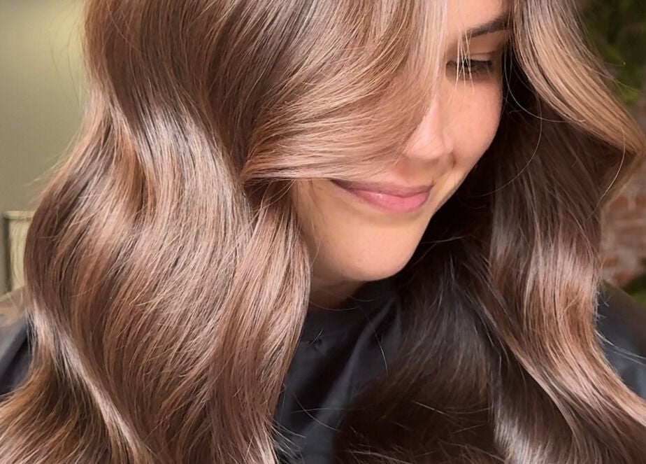 Smooth, glossy brown hair styled in waves at Studio Deja Wu, Melbourne, Victoria, AU.