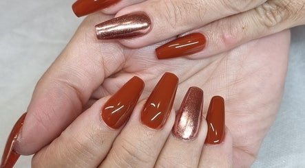 Stylish red and metallic manicure at Fabeauty, Maroochydore, Queensland, AU.