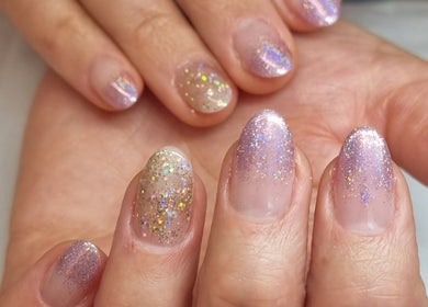 Glittery nail art on hands at Fabeauty, Maroochydore, Queensland, AU.