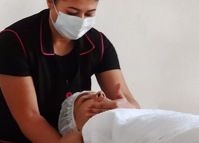 Therapist performing facial massage at Fabeauty in Maroochydore, Queensland, AU.