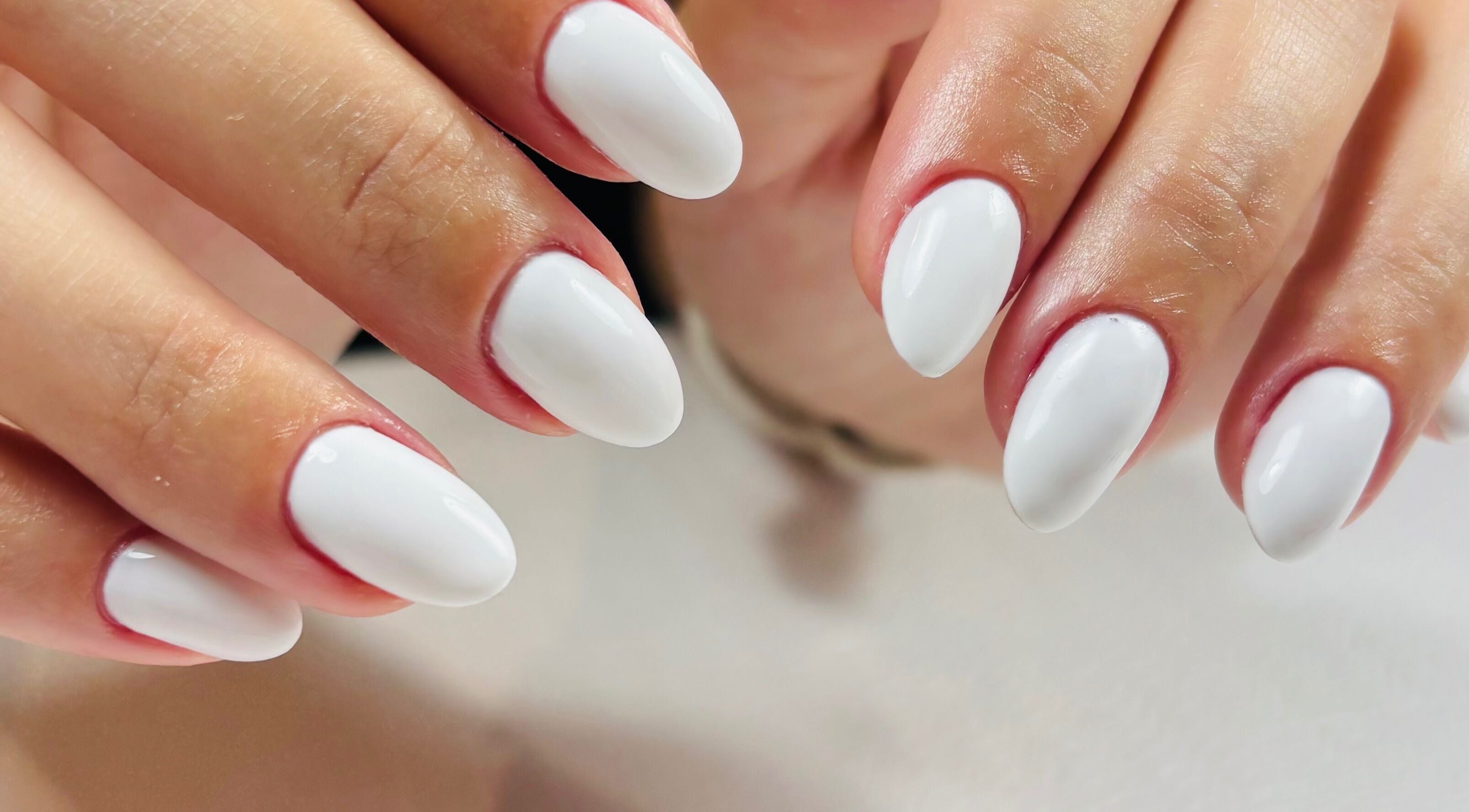 Close-up of a pristine white manicure at Fabeauty - Private home-based beauty studio, Maroochydore, Queensland, AU.