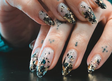 Elegant nail art with gold flakes at Lada Beauty Studio, Cape Town, Western Cape, ZA.