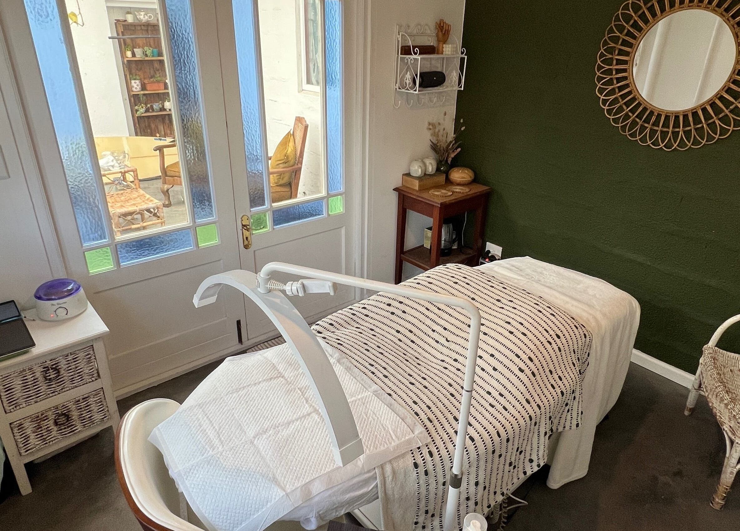 Cozy treatment room at Lada Beauty Studio, Cape Town, Western Cape, ZA, featuring elegant decor and tranquil ambiance.